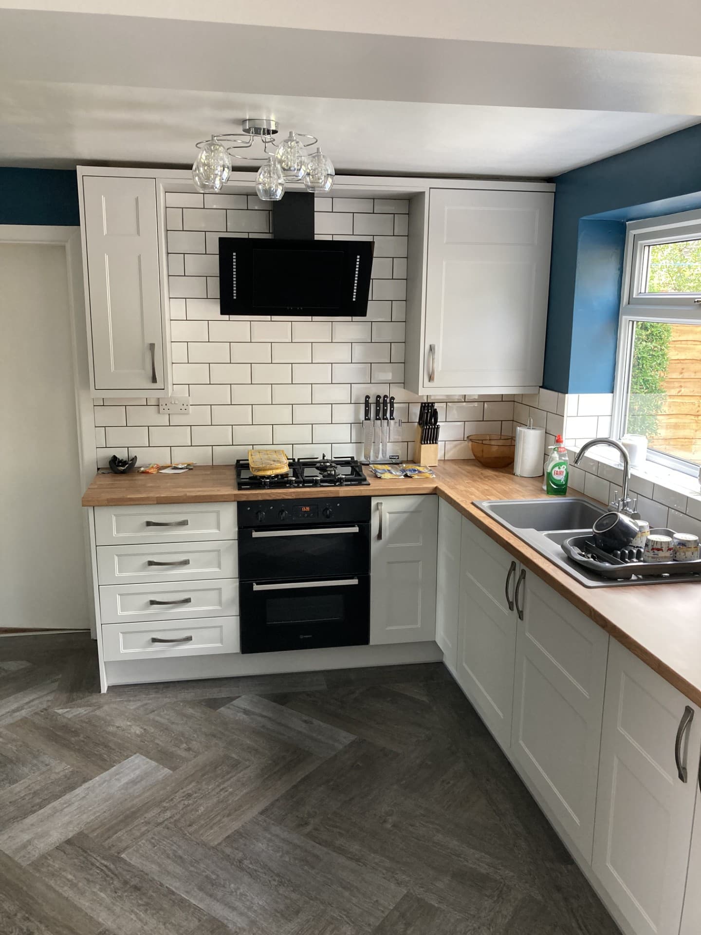 Kitchen door replacement project — new door fronts with pendant lighting